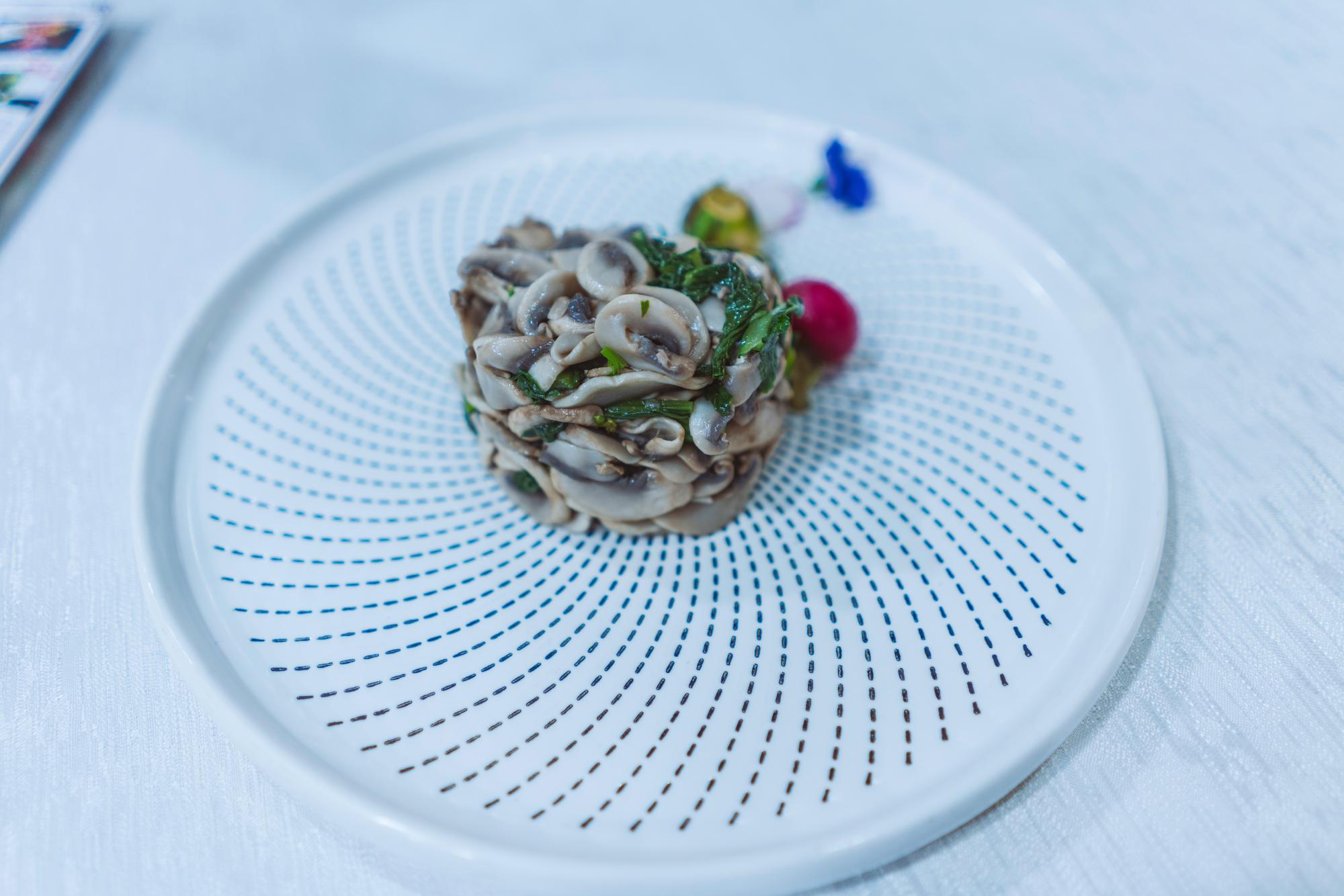 Close-up of plated modern dish with molecular garnish